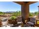 Inviting balcony space with comfortable seating and scenic views of the surrounding desert landscape at 19550 N Grayhawk Dr # 2023, Scottsdale, AZ 85255