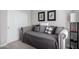 Cozy bedroom featuring a daybed with decorative pillows and adjacent closet for ample storage solutions at 19550 N Grayhawk Dr # 2023, Scottsdale, AZ 85255