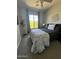 Bedroom featuring a window, bed, and decorative wall art at 19550 N Grayhawk Dr # 2023, Scottsdale, AZ 85255