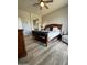 Cozy bedroom with warm wood furniture and light-colored floors, inviting relaxation at 19550 N Grayhawk Dr # 2023, Scottsdale, AZ 85255