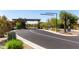 A wide shot of the community entrance with desert landscaping and a gated entry at 19550 N Grayhawk Dr # 2023, Scottsdale, AZ 85255