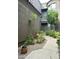 Inviting courtyard with desert landscaping leading to the front door at 19550 N Grayhawk Dr # 2023, Scottsdale, AZ 85255