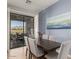 Chic dining area with scenic views, plantation shutters, and contemporary decor at 19550 N Grayhawk Dr # 2023, Scottsdale, AZ 85255