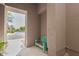 Inviting entrance with a quaint wooden bench, offering a welcoming curb appeal at 19550 N Grayhawk Dr # 2023, Scottsdale, AZ 85255