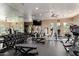 Fitness center with various machines, free weights, a mirrored wall, and ceiling fans at 19550 N Grayhawk Dr # 2023, Scottsdale, AZ 85255