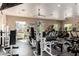 Community gym with weight machines and cardio equipment overlooking desert landscaping at 19550 N Grayhawk Dr # 2023, Scottsdale, AZ 85255