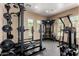 Gym featuring weight lifting equipment, including a Hammer Strength power rack and free weights at 19550 N Grayhawk Dr # 2023, Scottsdale, AZ 85255