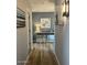 Inviting hallway with a mirrored console table and light wood floors that offer a modern touch at 19550 N Grayhawk Dr # 2023, Scottsdale, AZ 85255