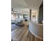 Open-concept living area showcasing wood-look flooring and plenty of natural light at 19550 N Grayhawk Dr # 2023, Scottsdale, AZ 85255