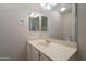 Well-lit bathroom featuring a light-toned vanity with a sink, a large mirror, and a towel ring at 1956 N Hubbard Ln, Casa Grande, AZ 85122