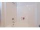 Close up of the tiled shower-tub combination, with a built-in soap holder at 1956 N Hubbard Ln, Casa Grande, AZ 85122