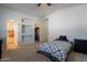 Bedroom featuring a bed, a dresser and a walk-in closet with built-in shelving at 1956 N Hubbard Ln, Casa Grande, AZ 85122