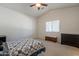 Spacious bedroom with vaulted ceilings, a window with blinds, and dark wood furniture at 1956 N Hubbard Ln, Casa Grande, AZ 85122