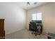 This home office bedroom features carpeted floors and a functional workspace at 1956 N Hubbard Ln, Casa Grande, AZ 85122