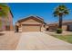Single-story home featuring desert landscaping, a two-car garage, and a well-maintained front yard at 1956 N Hubbard Ln, Casa Grande, AZ 85122
