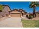 Single-story home featuring desert landscaping, a two-car garage, and a well-maintained front yard at 1956 N Hubbard Ln, Casa Grande, AZ 85122