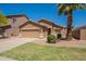 Single-story home featuring desert landscaping, a two-car garage, and a well-maintained front yard at 1956 N Hubbard Ln, Casa Grande, AZ 85122