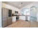 Bright kitchen boasts stainless steel appliances, white cabinets, and an open floor plan at 1956 N Hubbard Ln, Casa Grande, AZ 85122