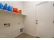 Laundry room featuring shelving, hookups, and an exterior door at 1956 N Hubbard Ln, Casa Grande, AZ 85122