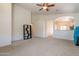 Bright and open living room with arches connecting to the kitchen and dining areas at 1956 N Hubbard Ln, Casa Grande, AZ 85122