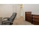 Home office with a grey office chair, door to hallway and a small bookcase at 1956 N Hubbard Ln, Casa Grande, AZ 85122