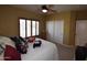 Relaxing bedroom offers a ceiling fan and window with shutters creating a tranquil retreat at 19880 W Desert Views Dr, Casa Grande, AZ 85122