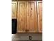 Kitchen upper cabinets made of wood with a natural finish at 19880 W Desert Views Dr, Casa Grande, AZ 85122