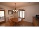 Dining area with table, 4 chairs, and chandelier at 19880 W Desert Views Dr, Casa Grande, AZ 85122