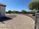 Driveway leading to homesites with desert landscaping and bright blue sky at 19880 W Desert Views Dr, Casa Grande, AZ 85122