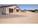 Stunning home exterior boasts a spacious three-car garage and well-maintained landscaping at 19880 W Desert Views Dr, Casa Grande, AZ 85122
