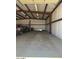 Inside steel garage showcasing ample open space, concrete floor, and steel beam framing and walls at 19880 W Desert Views Dr, Casa Grande, AZ 85122