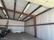 Inside steel garage showcasing ample open space, concrete floor, and steel beam framing and walls at 19880 W Desert Views Dr, Casa Grande, AZ 85122