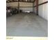 Spacious steel garage for storage and parking multiple vehicles with concrete floor and tall metal walls at 19880 W Desert Views Dr, Casa Grande, AZ 85122