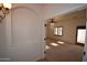 Hallway and doorway with carpeted floor and ceiling fan at 19880 W Desert Views Dr, Casa Grande, AZ 85122
