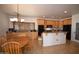 Bright kitchen and dining area includes custom cabinetry, granite countertop, and natural lighting at 19880 W Desert Views Dr, Casa Grande, AZ 85122
