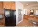 Kitchen with stainless steel refrigerator, pantry, and granite countertop at 19880 W Desert Views Dr, Casa Grande, AZ 85122