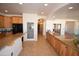 Kitchen boasts custom wood cabinets, a large pantry, and a spacious granite countertop at 19880 W Desert Views Dr, Casa Grande, AZ 85122