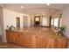 Open kitchen and living area features a granite countertop and natural light from large windows at 19880 W Desert Views Dr, Casa Grande, AZ 85122