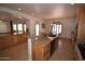 Spacious kitchen features stainless steel appliances, tile floors, and granite countertops at 19880 W Desert Views Dr, Casa Grande, AZ 85122