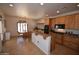 Well-equipped kitchen with custom wood cabinets, granite countertops, and stainless steel appliances at 19880 W Desert Views Dr, Casa Grande, AZ 85122