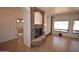 Living room with fireplace, and tile flooring at 19880 W Desert Views Dr, Casa Grande, AZ 85122