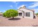 Exterior view of home with tile roof and desert landscaping at 20039 N Hearthstone Dr, Surprise, AZ 85374