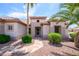 Inviting entryway with manicured bushes, a tiled walkway, and decorative desert landscaping at 20039 N Hearthstone Dr, Surprise, AZ 85374