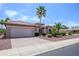 Well-maintained home with desert landscaping, a tile roof, and an attached garage at 20039 N Hearthstone Dr, Surprise, AZ 85374