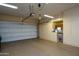 This spacious garage features an automatic door and tons of storage with built in cabinets and workstation at 20039 N Hearthstone Dr, Surprise, AZ 85374