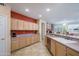 Open kitchen layout with ample counter space, stainless steel appliances, and seamless transitions at 20039 N Hearthstone Dr, Surprise, AZ 85374