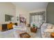 Spacious living room with comfortable furnishings and view into dining and Gathering room at 20039 N Hearthstone Dr, Surprise, AZ 85374