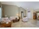Inviting living room with neutral walls, tile floors and comfortable seating arrangement at 20039 N Hearthstone Dr, Surprise, AZ 85374