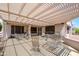 The large, covered patio is the perfect place to sit back and relax at 20039 N Hearthstone Dr, Surprise, AZ 85374