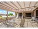 This covered patio is great for relaxing and enjoying the landscape at 20039 N Hearthstone Dr, Surprise, AZ 85374